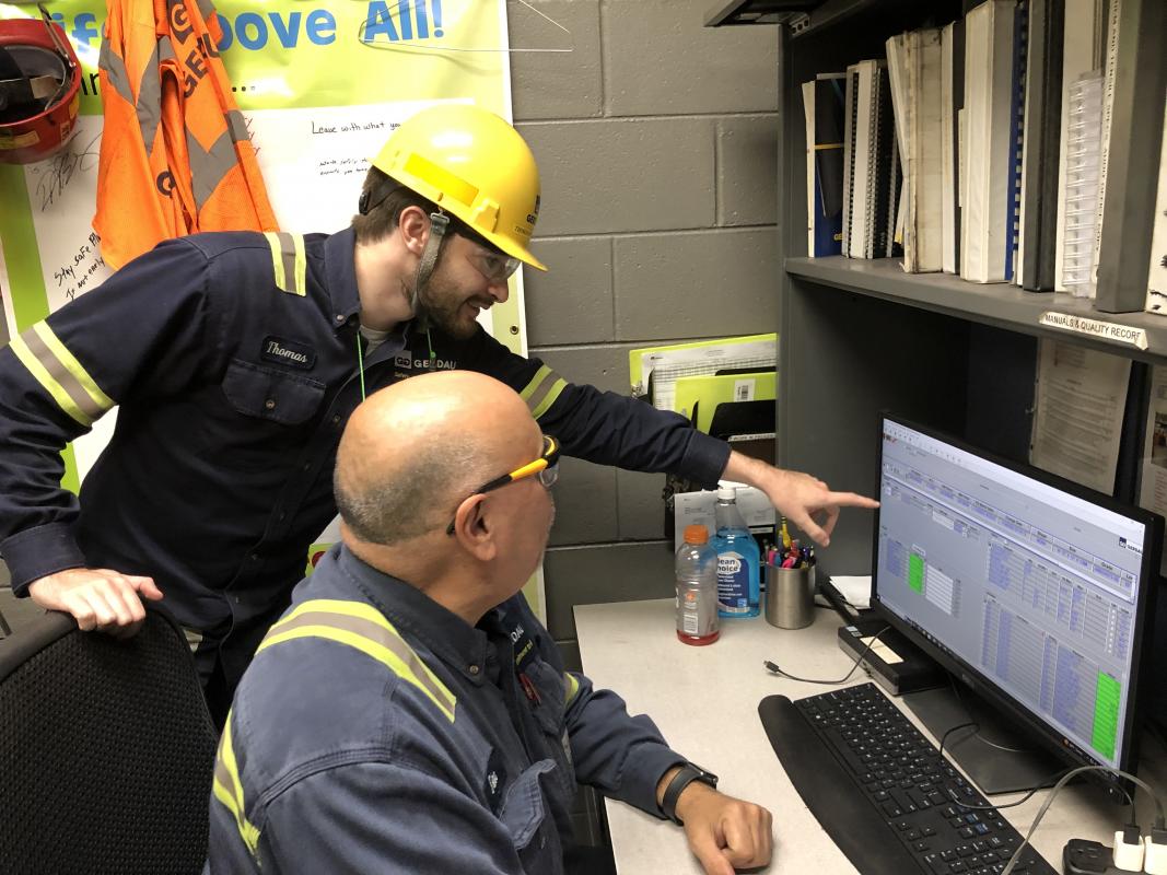 Bocchetti and coworker at computer